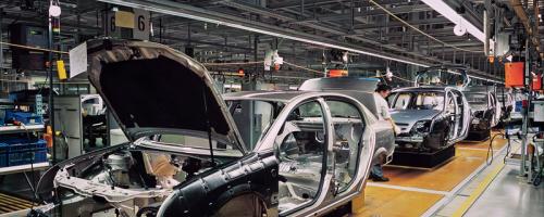 Automotive production line showing car body assembly and traceability in action