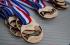 Laser engraving and cutting of wooden medals with personalized text and graphics