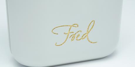 Close up of a plastic engraving filled with gold gilding wax